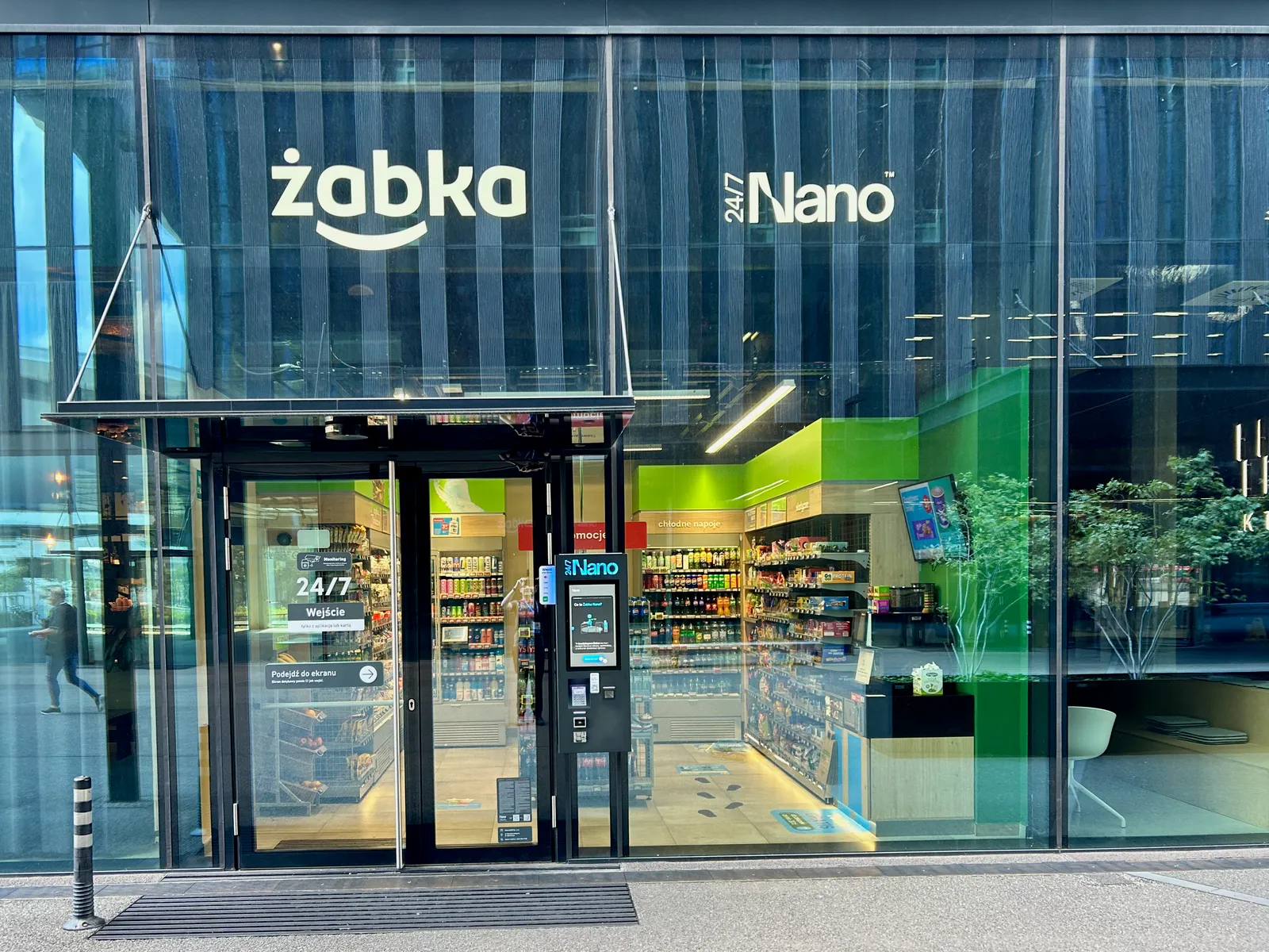 Street-facing Zabka Nano checkout-free store behind a glass facade in Katowice