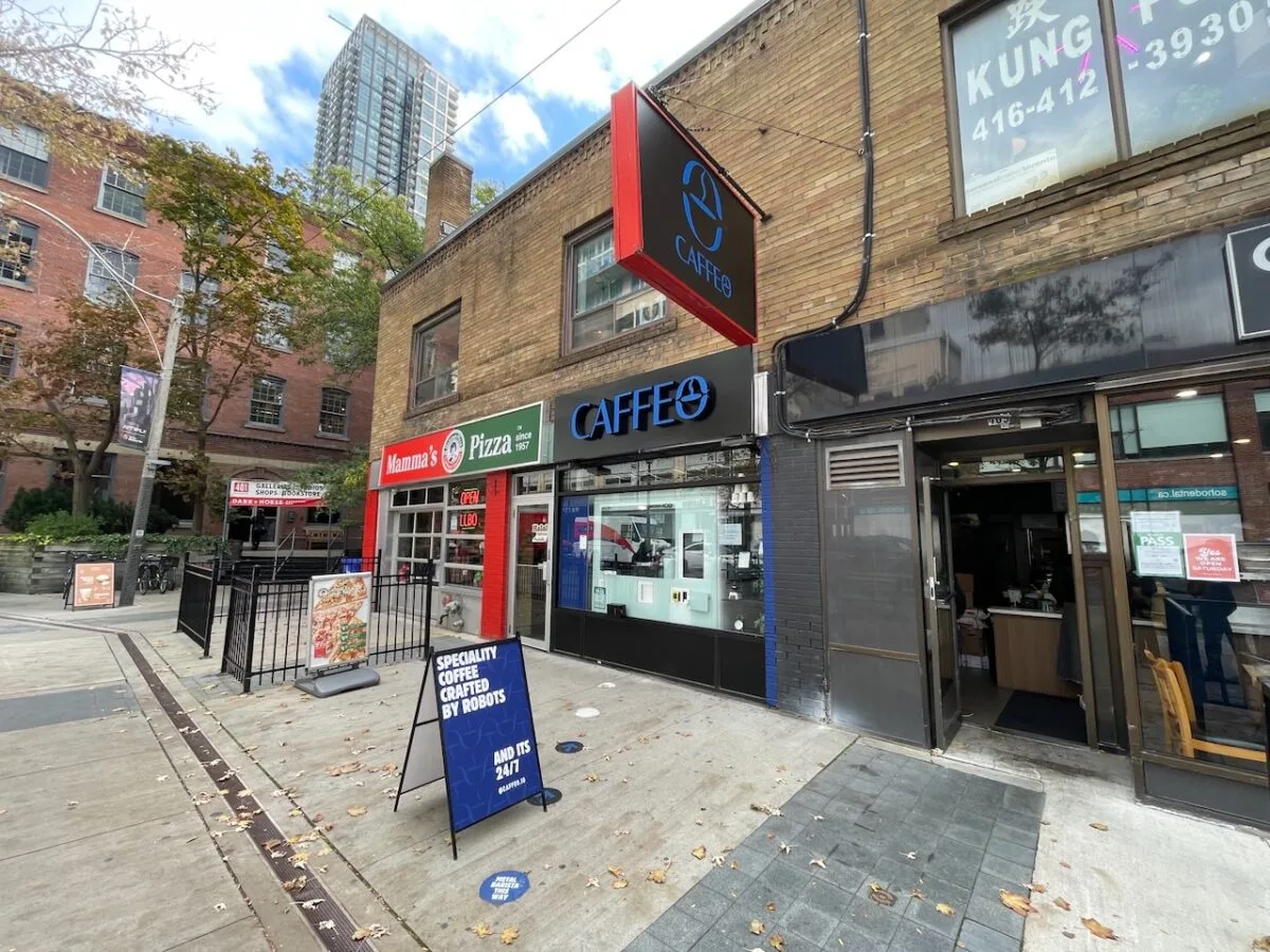 Caffeo storefront on Richmond Street West with a sandwich board reading speciality coffee crafted by robots