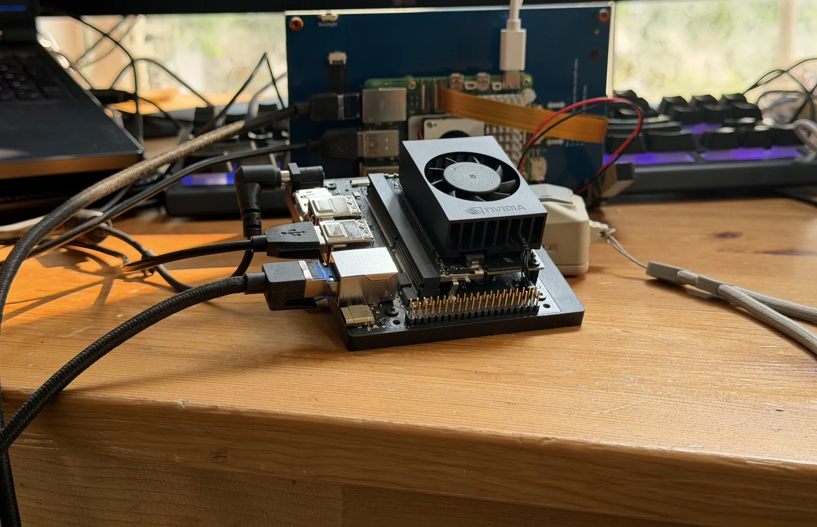 The $250-class edge computer on the bench in front of the checkout unit